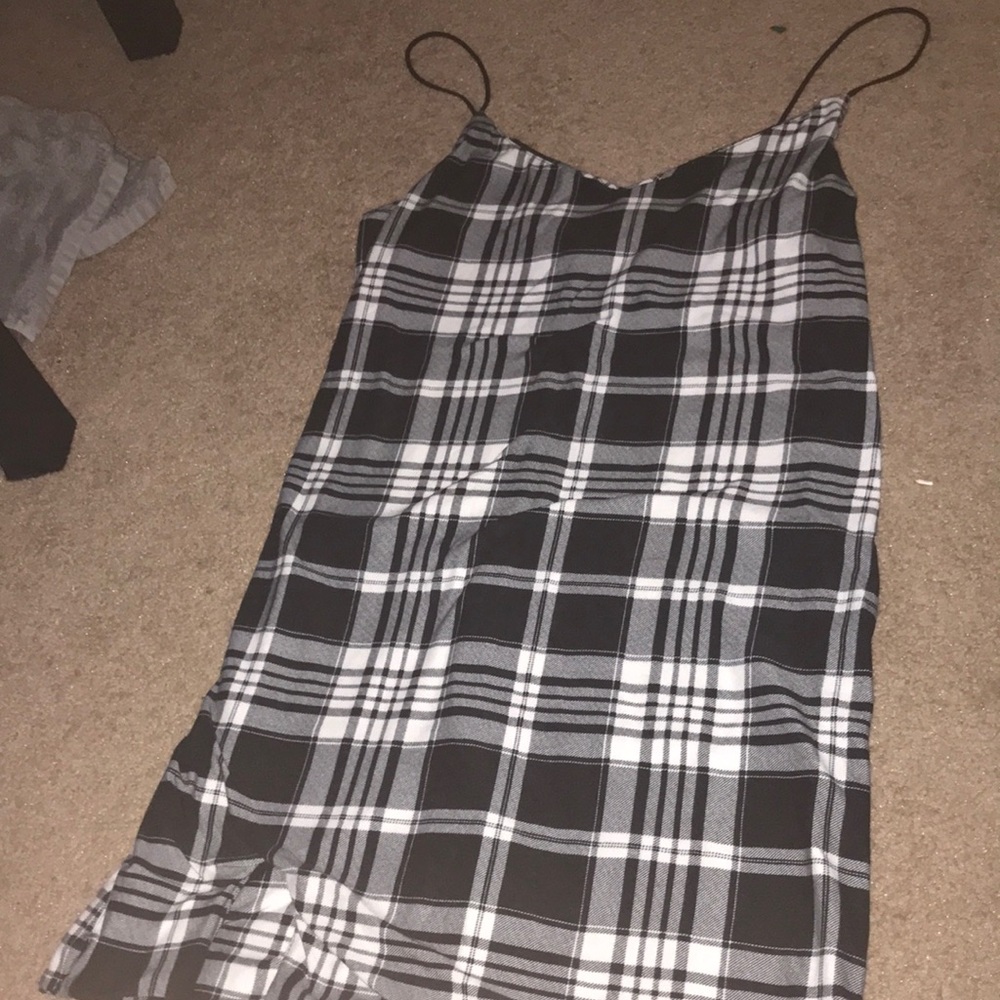 Plaid spaghetti strapped dress with small slit at the bottom